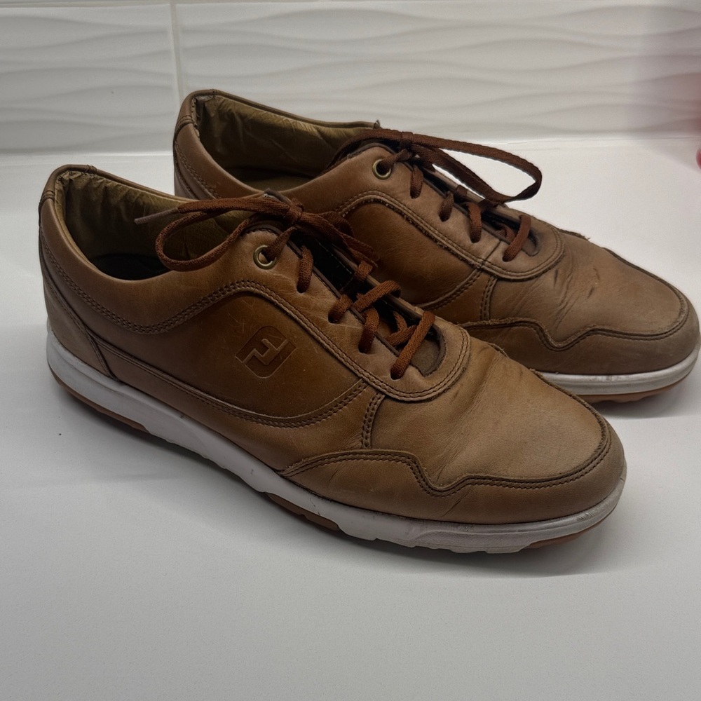 FootJoy men's casual spikeless golf shoes in brown leather